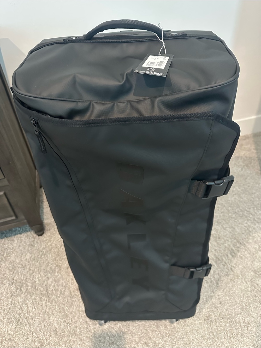 Oakley Matte Black Rolling Duffel with Compression Straps
